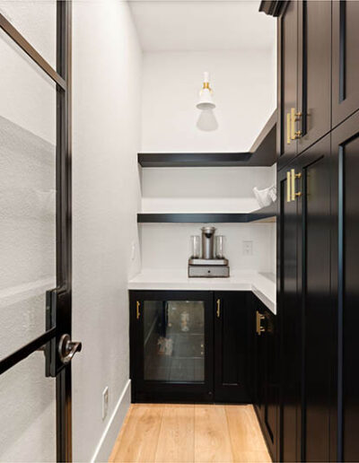 Isleworth custom pantry tricorn black glass door floating shelves