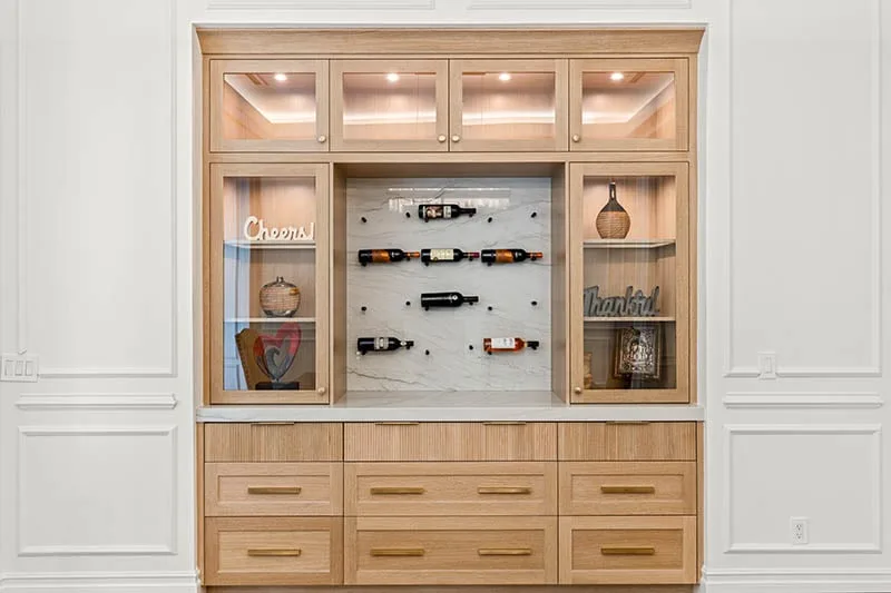 Rift white oak dining room cabinets with reeded doors and lighting Rift white oak dining room cabinets with reeded doors and lighting